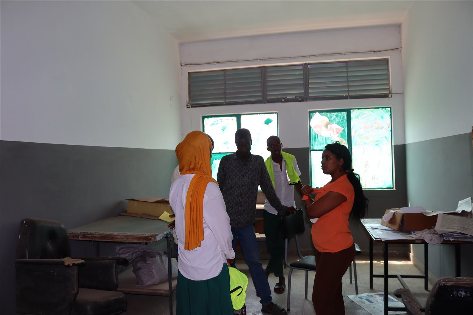 Election or registration materials being organized at student desks